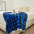 dog lying on blue plaid faux fur pet blanket